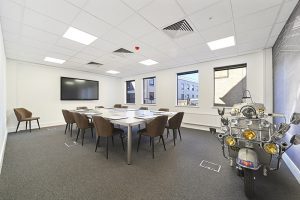 Create Business Hub - Brentwood Office Space For Rent - meeting room with motorbike decor